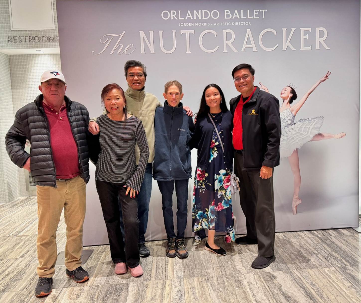 A group of people posing for a photo

Description automatically generated