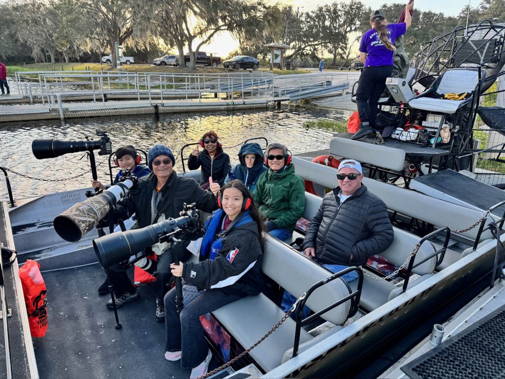 A group of people on a boat

Description automatically generated