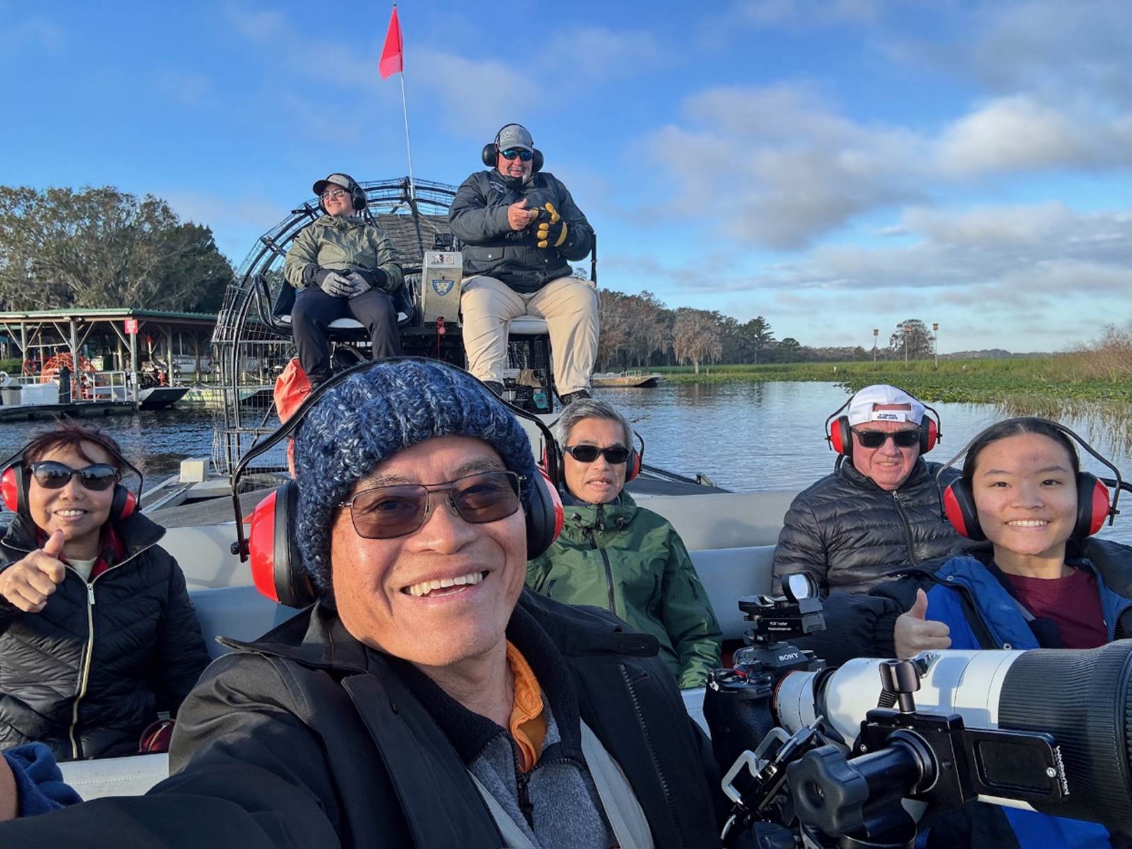 A group of people on a boat

Description automatically generated