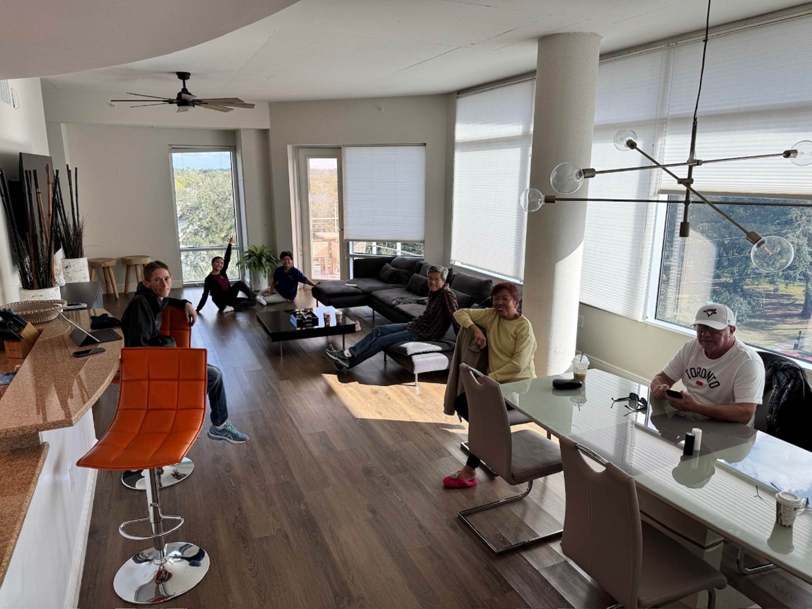 A group of people sitting around a table

Description automatically generated