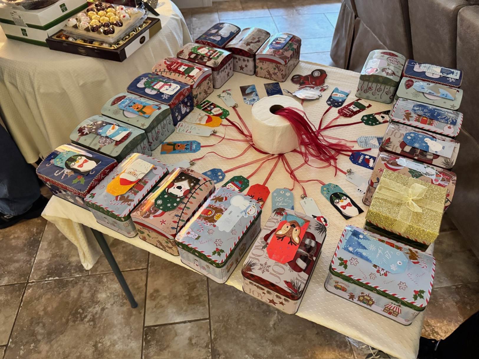 A table with boxes and rolls of toilet paper

Description automatically generated