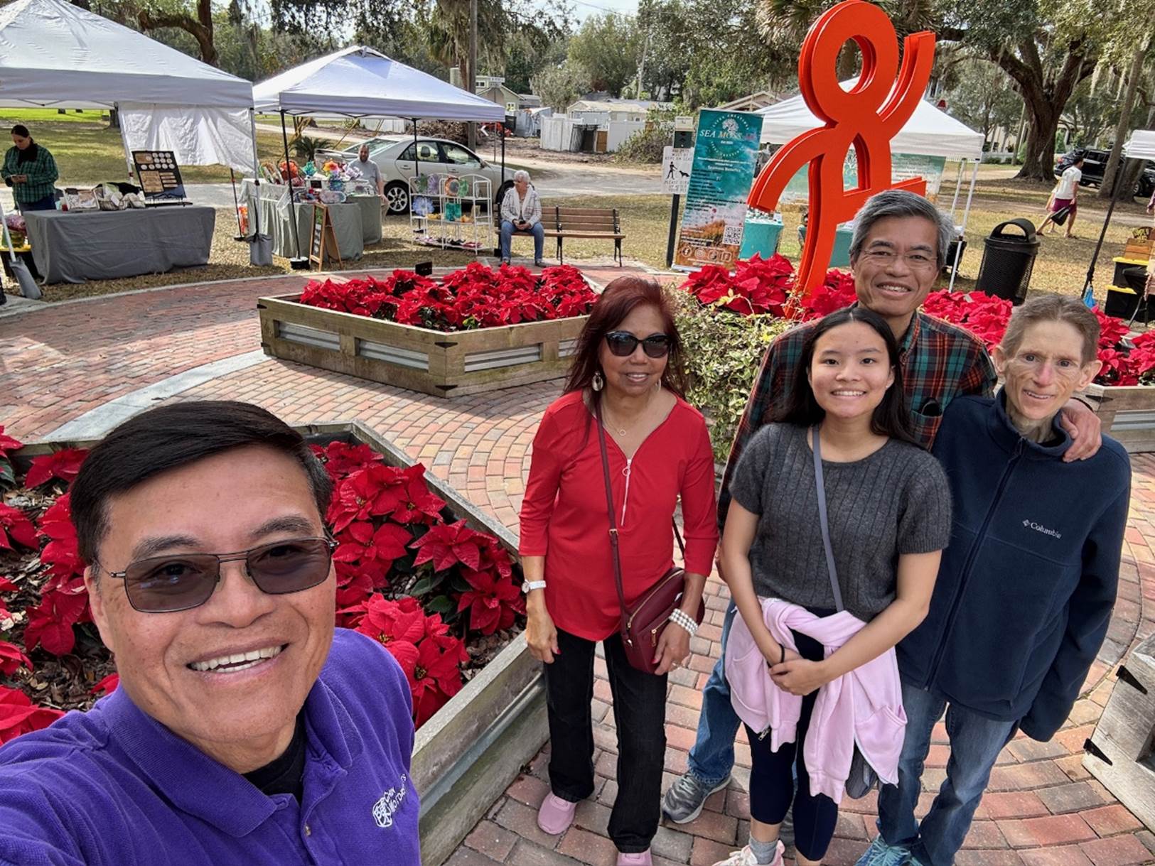 A group of people posing for a photo

Description automatically generated