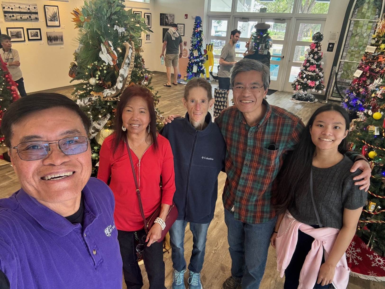 A group of people posing for a photo

Description automatically generated