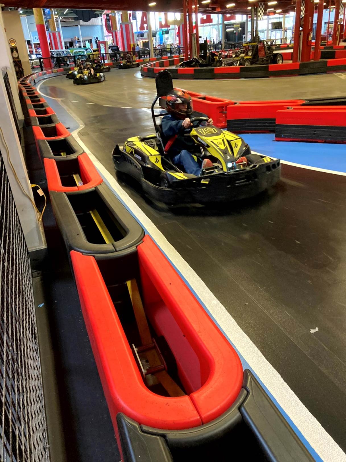 A group of people driving go karts

Description automatically generated