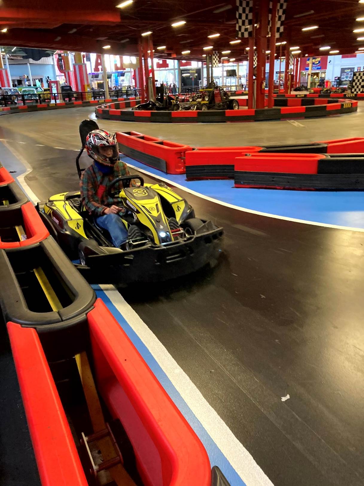 A person driving a go-kart

Description automatically generated