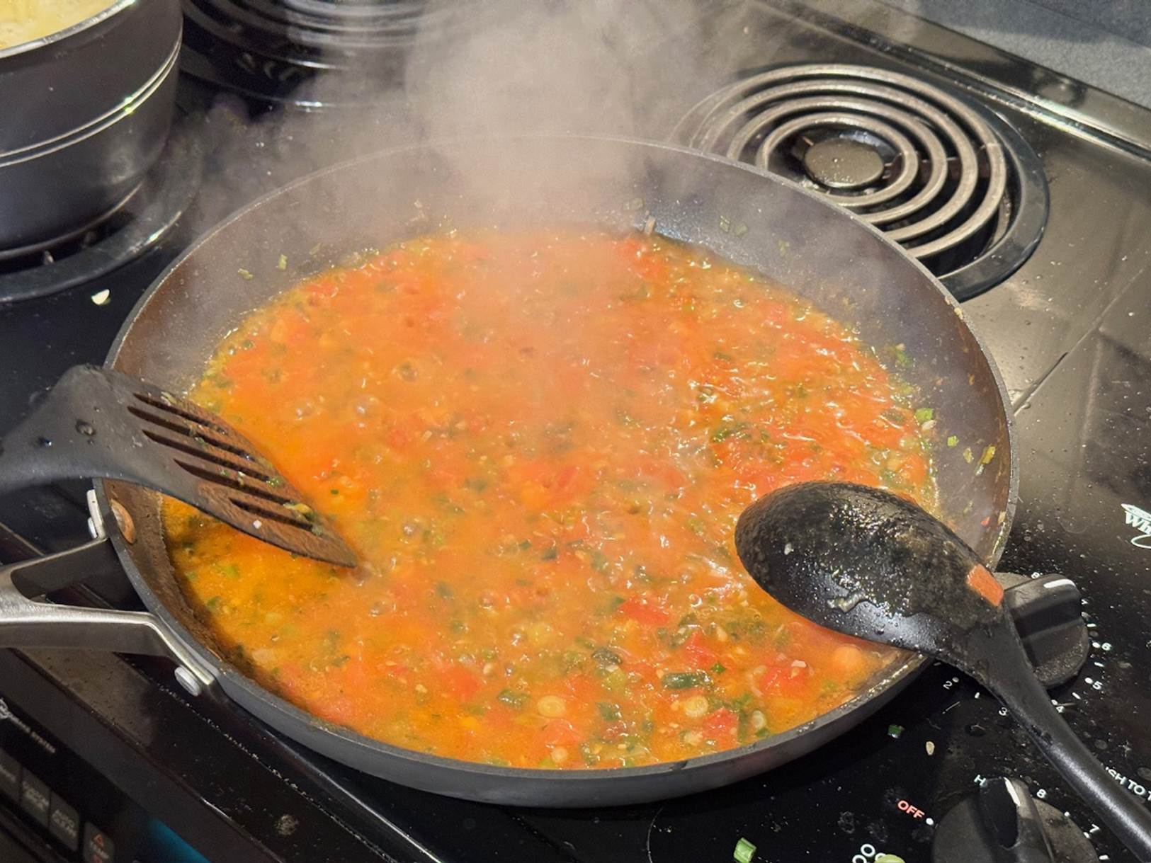 A pan of food with steam coming out of it

Description automatically generated
