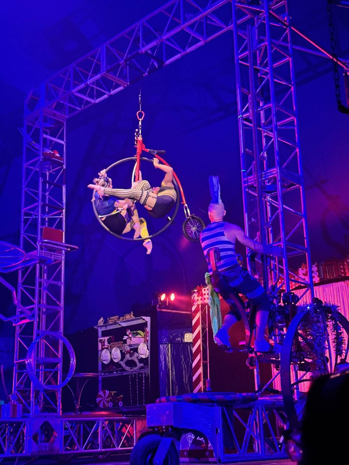 A group of people performing on a stage

Description automatically generated