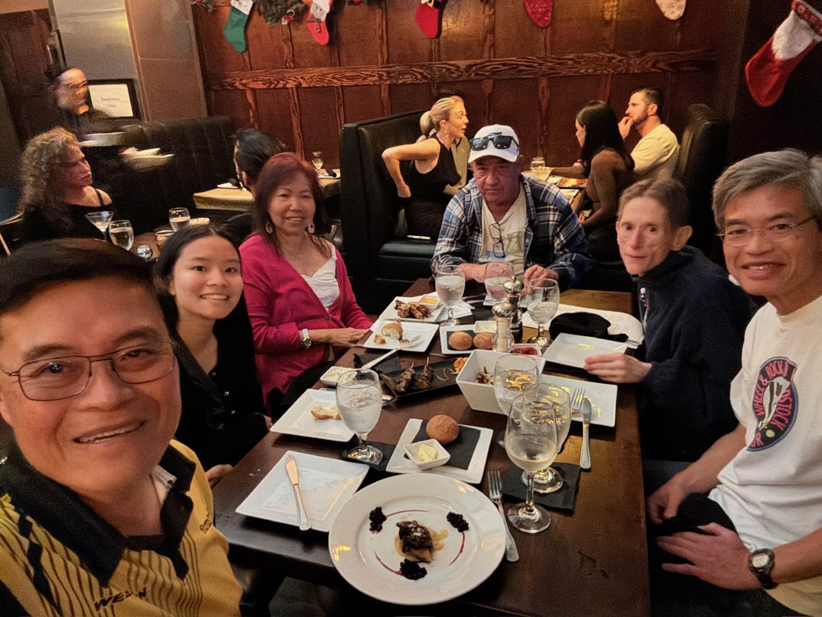 A group of people sitting at a table

Description automatically generated